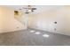 Bright living room featuring tile floors, neutral paint, and a ceiling fan at 9753 Villa Lorena Ave, Las Vegas, NV 89147