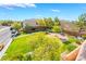 Balcony view of a green park with picnic tables, sidewalks and mature trees at 9753 Villa Lorena Ave, Las Vegas, NV 89147
