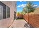 Exterior patio with brick pavers, stucco walls and view of tree at 9753 Villa Lorena Ave, Las Vegas, NV 89147