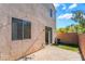 Exterior patio with brick pavers, stucco walls and grass at 9753 Villa Lorena Ave, Las Vegas, NV 89147