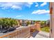 Balcony view overlooking the street, houses and beautiful blue sky at 9753 Villa Lorena Ave, Las Vegas, NV 89147