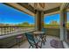 Cozy balcony with seating and scenic views of the surrounding neighborhood and mountains at 1001 Domnus Ln # 201, Las Vegas, NV 89144