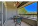 Cozy balcony with seating and scenic views of the surrounding neighborhood and mountains at 1001 Domnus Ln # 201, Las Vegas, NV 89144