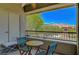 Cozy balcony with seating and scenic views of the surrounding neighborhood and mountains at 1001 Domnus Ln # 201, Las Vegas, NV 89144