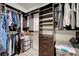 Spacious walk-in closet with custom shelving and ample storage for clothing and accessories at 1001 Domnus Ln # 201, Las Vegas, NV 89144