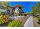 Beautiful exterior showcasing landscaping, stairs, and walking paths leading to the building at 1001 Domnus Ln # 201, Las Vegas, NV 89144