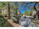 Exterior view of community, with well-maintained landscaping and inviting walkways at 1001 Domnus Ln # 201, Las Vegas, NV 89144