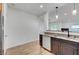 Kitchen featuring stainless steel dishwasher, granite countertops, and custom dark wooden cabinets at 1001 Domnus Ln # 201, Las Vegas, NV 89144