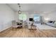 Bright and airy living room features a dining area and sliding glass doors to a balcony at 1001 Domnus Ln # 201, Las Vegas, NV 89144