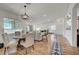Bright living room features wood floors, open floor plan, dining area, and lots of natural light at 1001 Domnus Ln # 201, Las Vegas, NV 89144