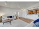 Well-lit living room showcases access to the kitchen and other rooms with hardwood floors at 1001 Domnus Ln # 201, Las Vegas, NV 89144