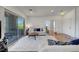 Open concept living room with a sliding glass door to the balcony and access to other rooms at 1001 Domnus Ln # 201, Las Vegas, NV 89144