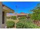 Exterior view of building with desert landscape, clear blue sky and mountain background at 1001 Domnus Ln # 201, Las Vegas, NV 89144