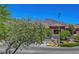 Commercial building view with desert plants and mountain backdrop under sunny sky at 1001 Domnus Ln # 201, Las Vegas, NV 89144