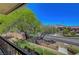 Neighborhood view from balcony showcasing the road, trees and beautiful blue sky at 1001 Domnus Ln # 201, Las Vegas, NV 89144