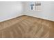 Bedroom featuring neutral carpet, a window, and double door closet at 10056 Cranbrook Falls Ct, Las Vegas, NV 89148