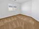 Bright bedroom with a window and neutral carpet at 10056 Cranbrook Falls Ct, Las Vegas, NV 89148