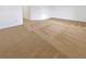 Spacious living room featuring neutral colored carpet and trim at 10056 Cranbrook Falls Ct, Las Vegas, NV 89148