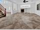 Spacious living room with fireplace, tile flooring, and neutral paint, offering a blank canvas for personalization at 10056 Cranbrook Falls Ct, Las Vegas, NV 89148