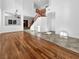 Bright living room with wood and tile floors, staircase, chandelier, and clerestory windows at 10056 Cranbrook Falls Ct, Las Vegas, NV 89148