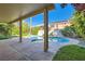 Outdoor living space with a pool and a covered patio at 10241 Regents Cross Pl, Las Vegas, NV 89144