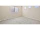 Comfortable bedroom with neutral paint, a large window, and carpeted floors at 10241 Regents Cross Pl, Las Vegas, NV 89144