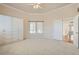 Spacious Primary bedroom featuring a ceiling fan, built-in storage, and natural light at 10241 Regents Cross Pl, Las Vegas, NV 89144