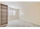 Bright bedroom with neutral walls, carpet, and window with blinds at 10241 Regents Cross Pl, Las Vegas, NV 89144
