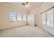 Bright bedroom with many windows, natural light, and a built-in closet at 10241 Regents Cross Pl, Las Vegas, NV 89144