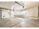 Spacious garage with ample storage and shelving, and epoxy floors at 10241 Regents Cross Pl, Las Vegas, NV 89144