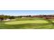 Scenic view of the lush green golf course and surrounding community homes at 10241 Regents Cross Pl, Las Vegas, NV 89144