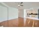 Spacious living room featuring wood floors, ample natural light, and open to the kitchen at 10241 Regents Cross Pl, Las Vegas, NV 89144