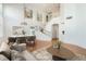 Staged living room showcasing high ceilings, modern decor, and elegant stairway at 10241 Regents Cross Pl, Las Vegas, NV 89144
