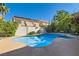 Backyard pool featuring a spa and mature landscaping for privacy at 10241 Regents Cross Pl, Las Vegas, NV 89144