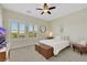 Bright bedroom with shuttered windows and neutral carpet at 10697 Acacia Park Pl, Las Vegas, NV 89135