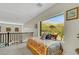 Bright bedroom area with large window and neighborhood views at 10697 Acacia Park Pl, Las Vegas, NV 89135