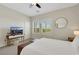 Comfortable bedroom with natural light and ceiling fan at 10697 Acacia Park Pl, Las Vegas, NV 89135