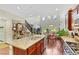 Kitchen boasts an island with seating, granite counters, and stainless steel appliances at 10697 Acacia Park Pl, Las Vegas, NV 89135