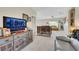 Living room with a large television and neutral decor at 10697 Acacia Park Pl, Las Vegas, NV 89135