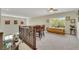 Open loft area with seating and an adjacent pool view at 10697 Acacia Park Pl, Las Vegas, NV 89135