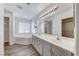 Bathroom with double sink vanity and large soaking tub at 11028 Meadow Leaf Ave, Las Vegas, NV 89144