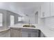 Bright, renovated kitchen with white cabinetry, stainless steel appliances, and quartz countertops at 11028 Meadow Leaf Ave, Las Vegas, NV 89144