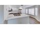 Modern kitchen featuring white cabinets, stainless steel appliances, and a breakfast bar at 11028 Meadow Leaf Ave, Las Vegas, NV 89144