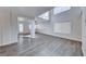 Airy open-concept living space with soaring ceilings and stylish hardwood flooring at 11028 Meadow Leaf Ave, Las Vegas, NV 89144