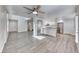 Open concept living area featuring updated kitchen with new appliances, fresh paint, and wood-look flooring at 11028 Meadow Leaf Ave, Las Vegas, NV 89144