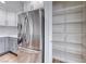 Stainless steel refrigerator and walk-in pantry with wire shelving at 11028 Meadow Leaf Ave, Las Vegas, NV 89144