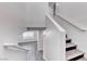 Staircase featuring wood steps with a white handrail at 11028 Meadow Leaf Ave, Las Vegas, NV 89144