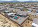 Aerial view featuring a home, hot tub, gazebo, and large metal storage shed in a neighborhood at 111 Magnolia Blvd, Pahrump, NV 89048