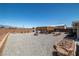 Huge backyard featuring an above ground pool, gravel, and desert landscaping at 111 Magnolia Blvd, Pahrump, NV 89048