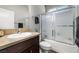 Bathroom with a vanity, framed mirror, and shower with sliding glass door at 111 Magnolia Blvd, Pahrump, NV 89048